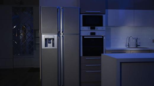 A refrigerator in a kitchen during a power outage.