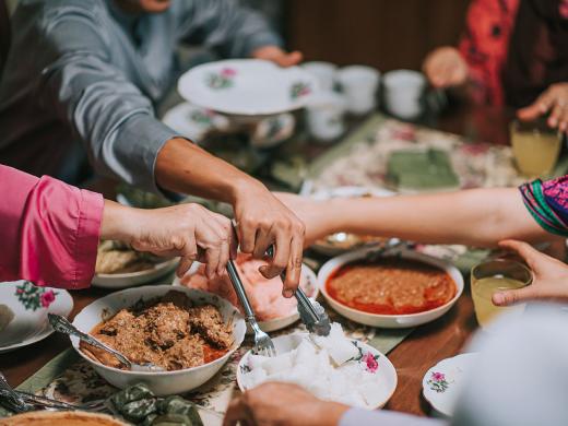 close up of a family at a table celebrating EID